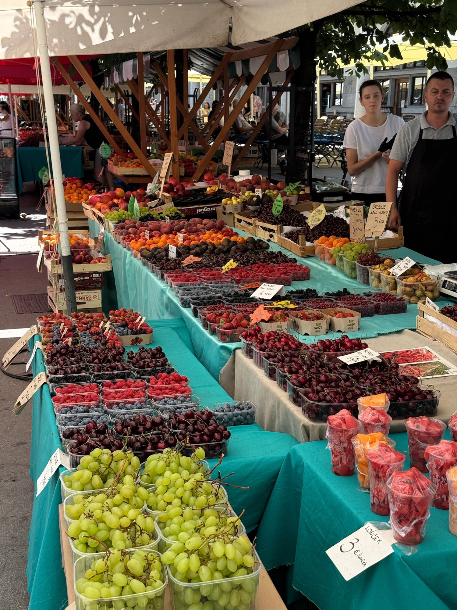 A colorful farmers market fruit stand